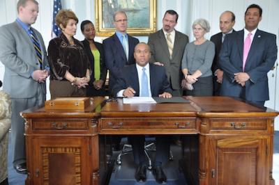 Redistricting plan becomes law: Governor Patrick signed the legislation passed by the House and Senate on Thursday. Photo: Governor's office